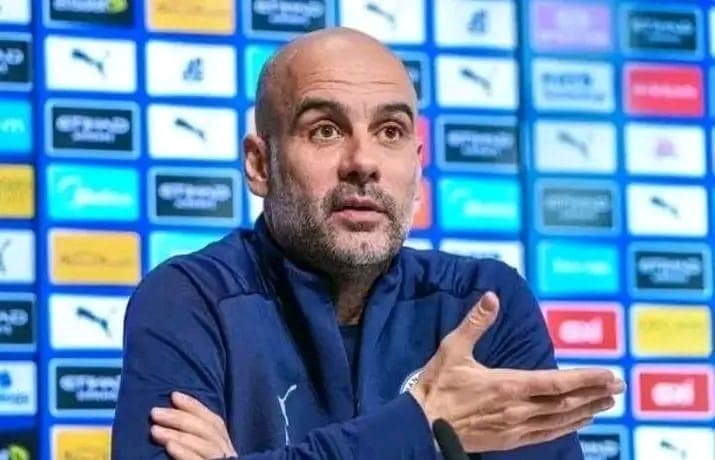 Pep Guardiola reacts after watching Arsenal beat Bayer Leverkusen.